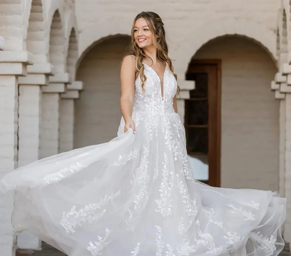 Model wearing a white Essense of Australia Fall 2024 gown