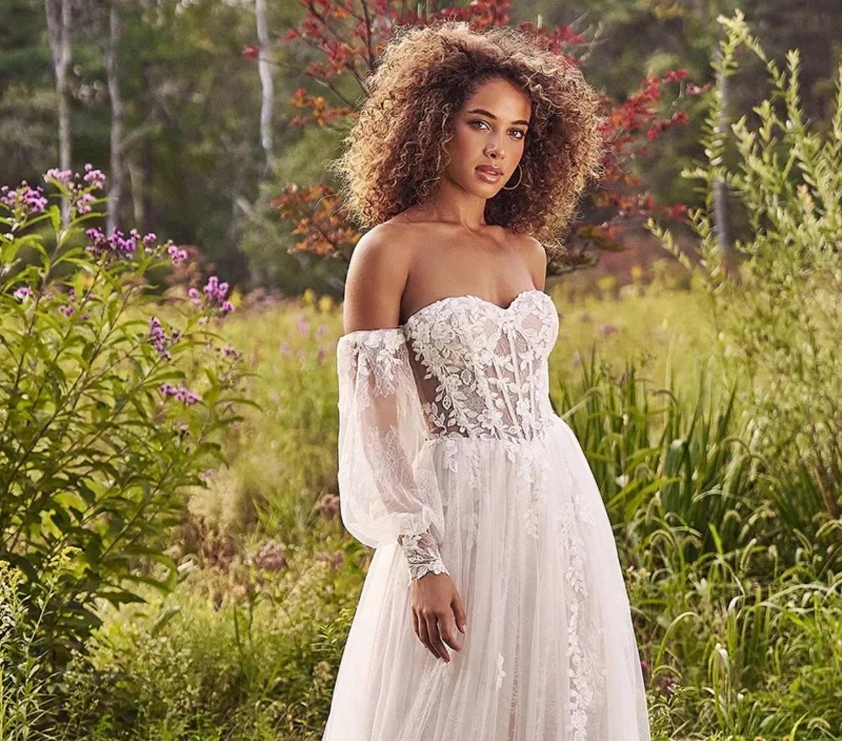 Model wearing a Lillian West Fall 2024 white gown